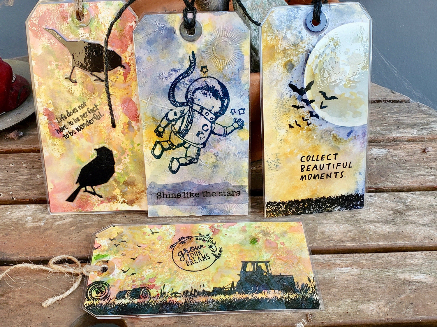 Four colorful bookmarks with designs